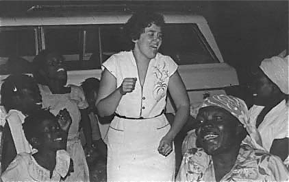 Susan rejoicing with women of Haiti.