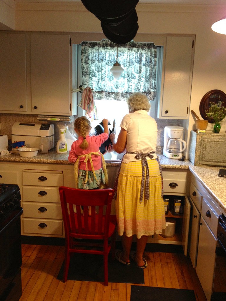 Susan with granddaughter, Eve in the kitchen.