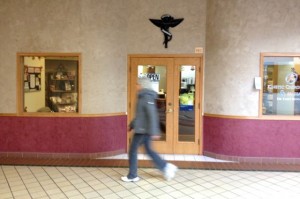 Susan walking past the chiropractic office at the mall.