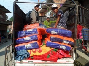 Carrying goods to earthquake victims.