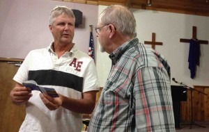 Bruce Shockman practicing sharing Christ with Steve Nelson.