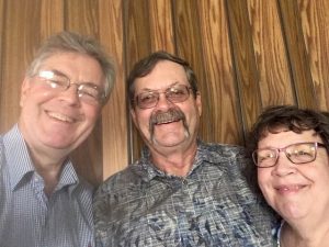 Tom with Pastors Chris and Joyce Caugherty of Faith Family Christian Center.