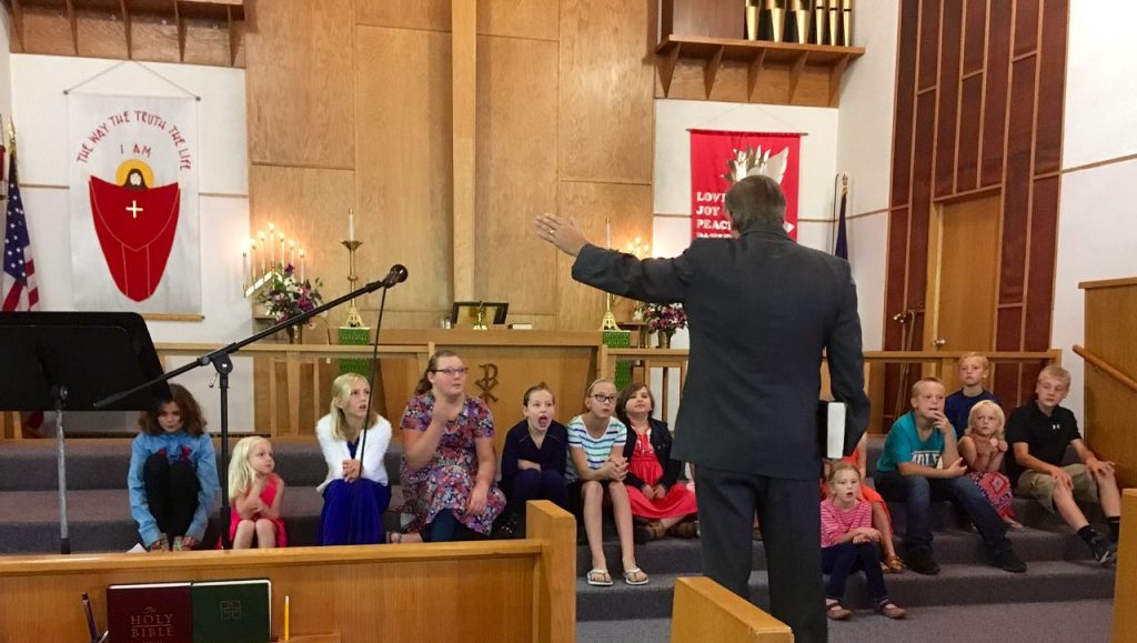 Pastor Rob Buechler teaching the children.